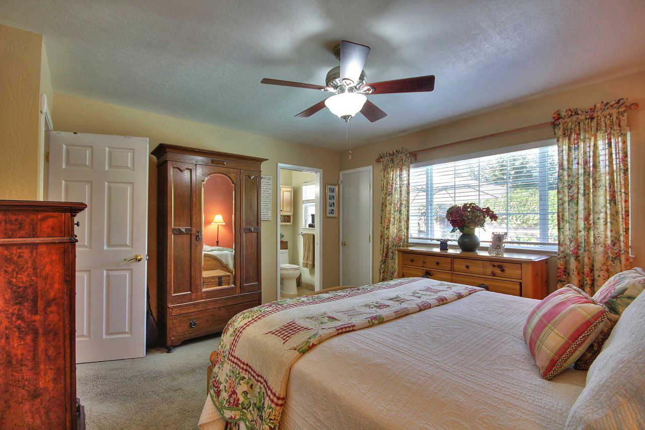 3953 Bucknall Road Campbell, CA 95008 - Photo 21 of 30 a bedroom with a large bed and a large window