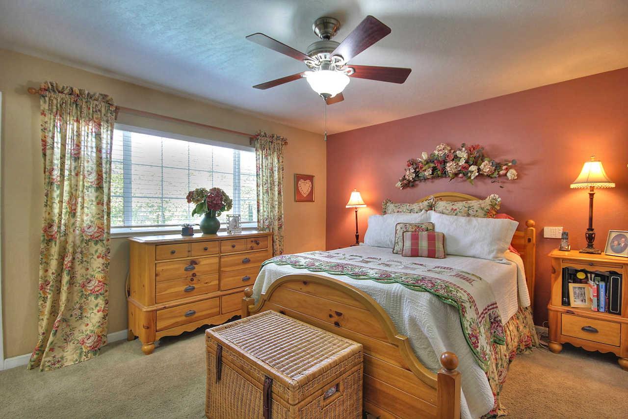 3953 Bucknall Road Campbell, CA 95008 - Photo 23 of 30 a bedroom with a bed and a chandelier