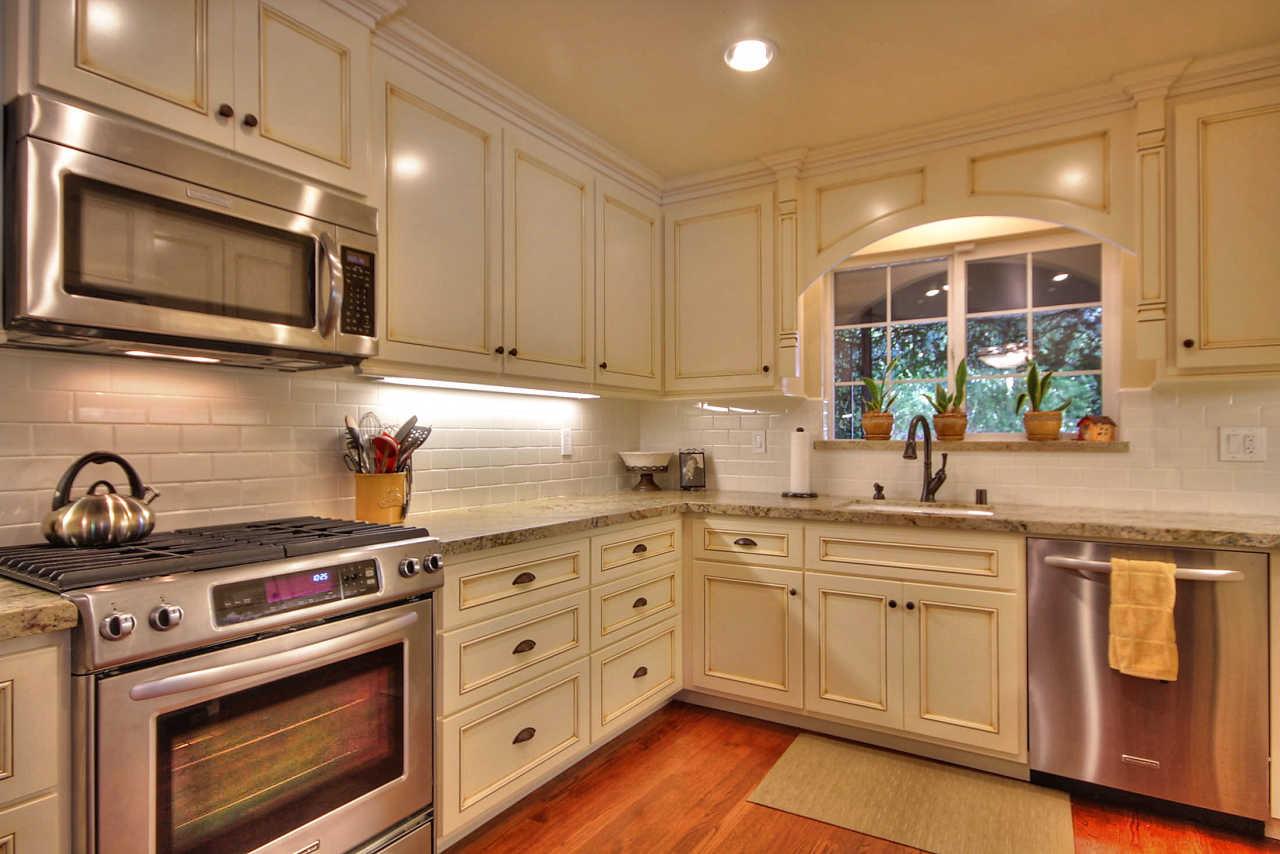 3953 Bucknall Road Campbell, CA 95008 - Photo 6 of 30 a kitchen with stainless steel appliances a stove a sink and cabinets