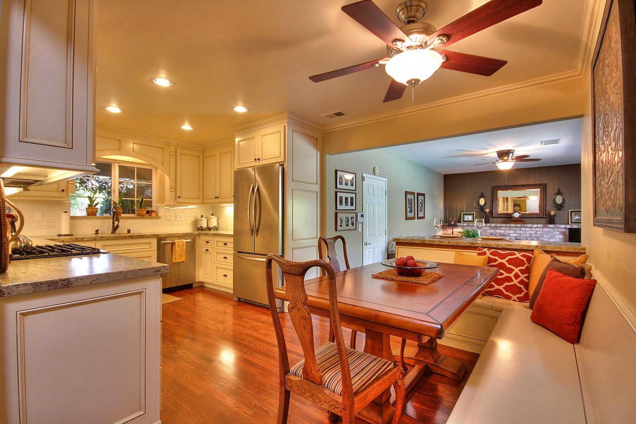 3953 Bucknall Road Campbell, CA 95008 - Photo 9 of 30 a dining table chairs and a kitchen with a sink