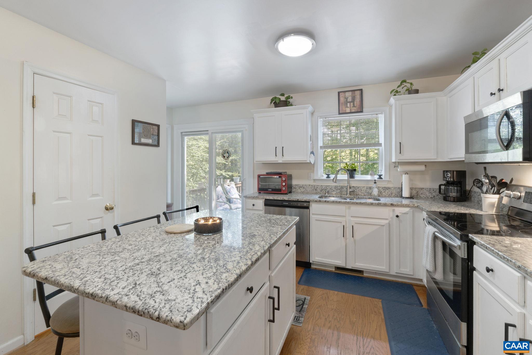 89 Riverside Drive Palmyra, VA 22963 - Photo 14 of 47 a kitchen with stainless steel appliances granite countertop a sink stove and cabinets