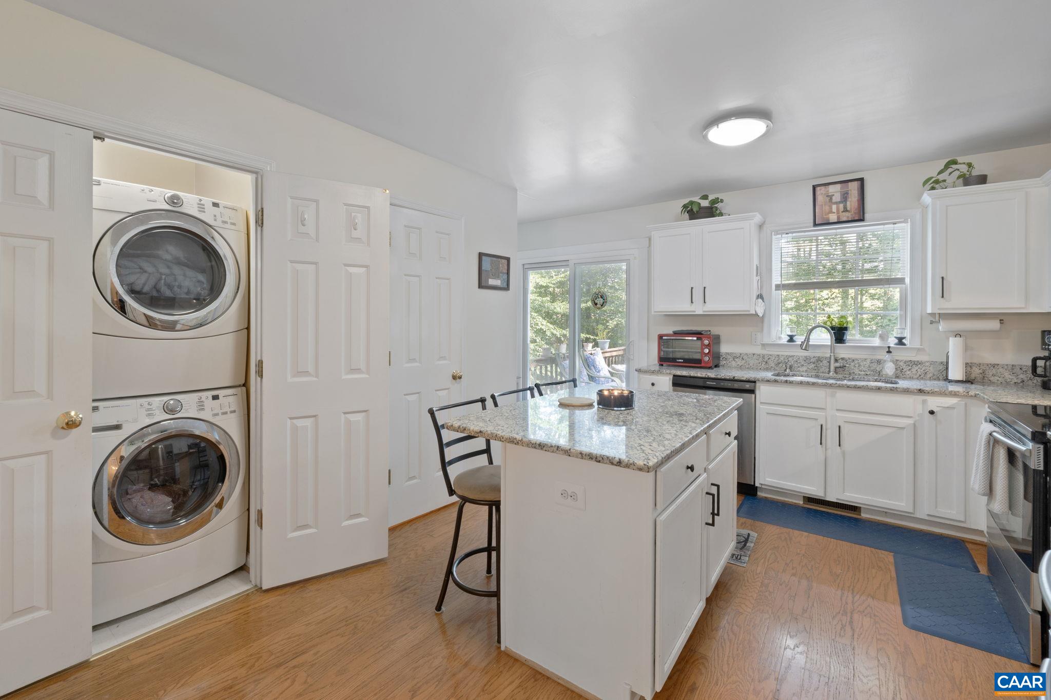 89 Riverside Drive Palmyra, VA 22963 - Photo 15 of 47 a kitchen with a stove top oven sink and cabinets