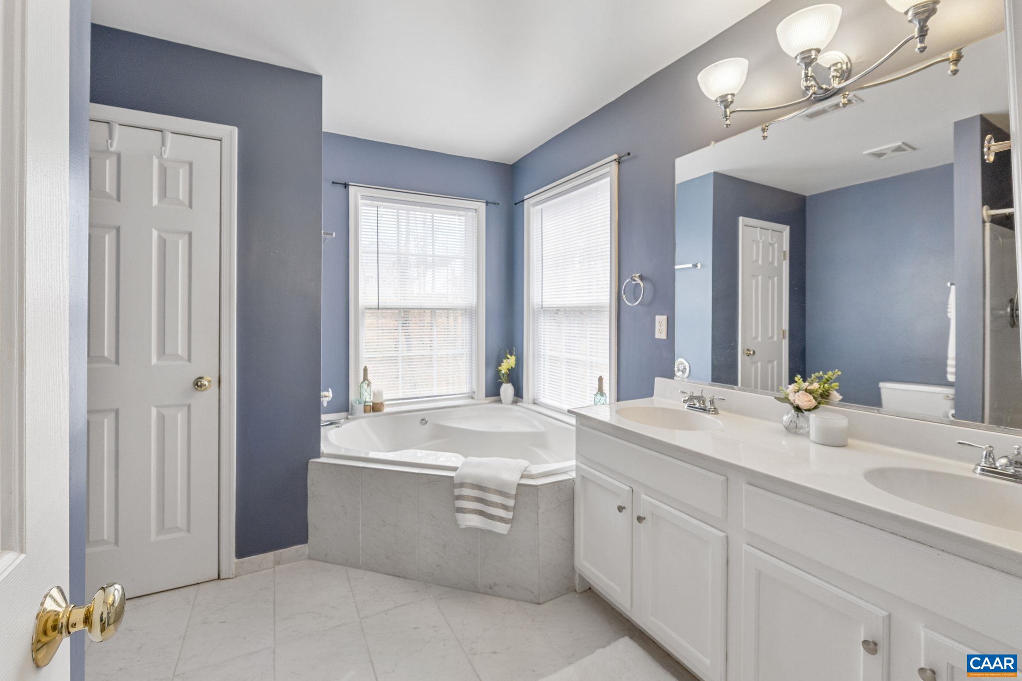 89 Riverside Drive Palmyra, VA 22963 - Photo 16 of 38 a room with a sink double vanity and a mirror