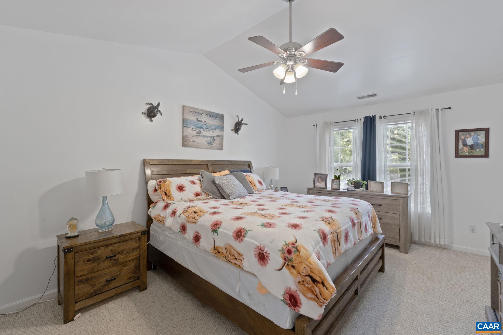 89 Riverside Drive Palmyra, VA 22963 - Photo 17 of 47 a bedroom with a bed chandelier and a window