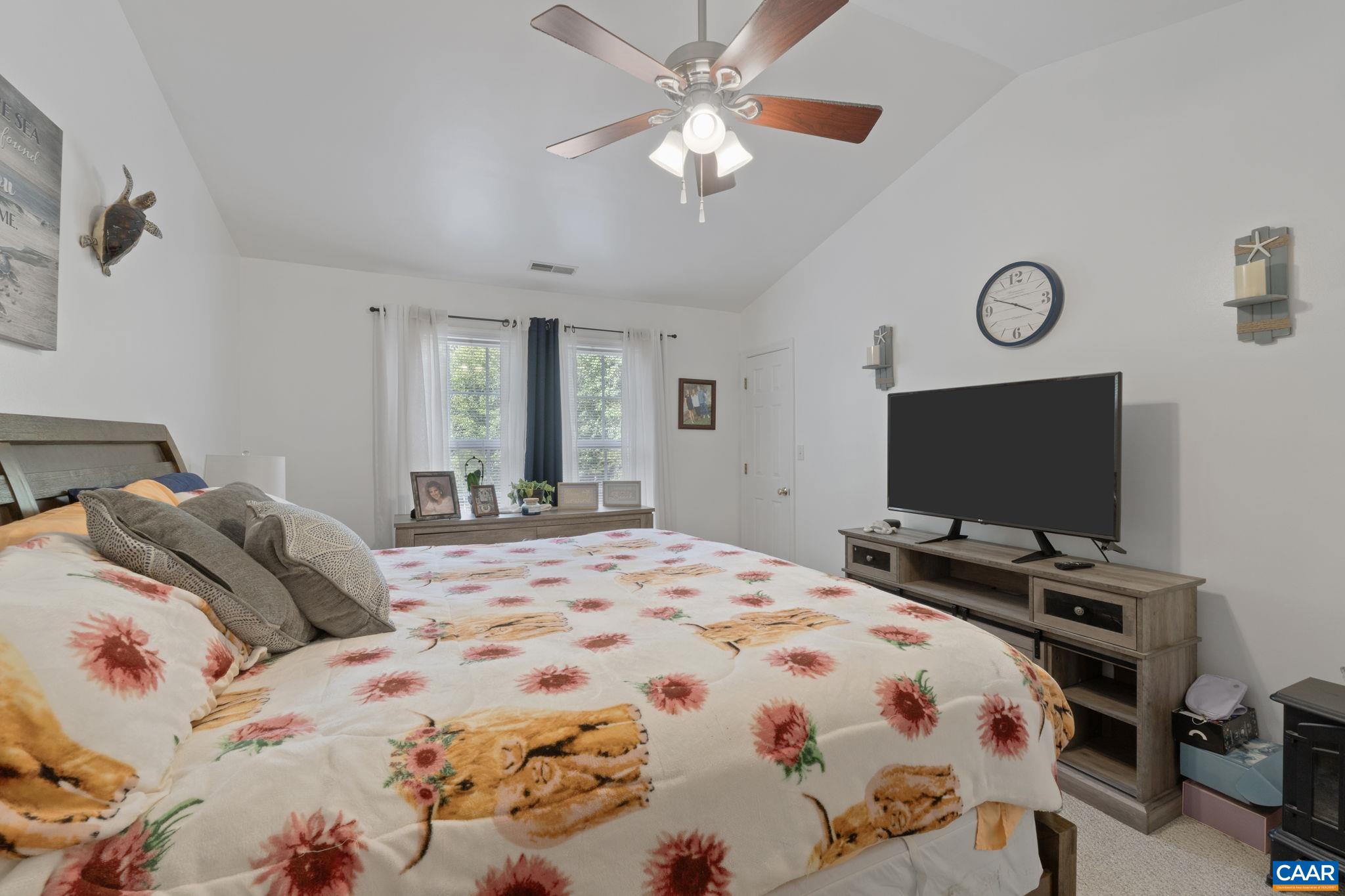 89 Riverside Drive Palmyra, VA 22963 - Photo 19 of 47 a bedroom with a bed and a flat screen tv