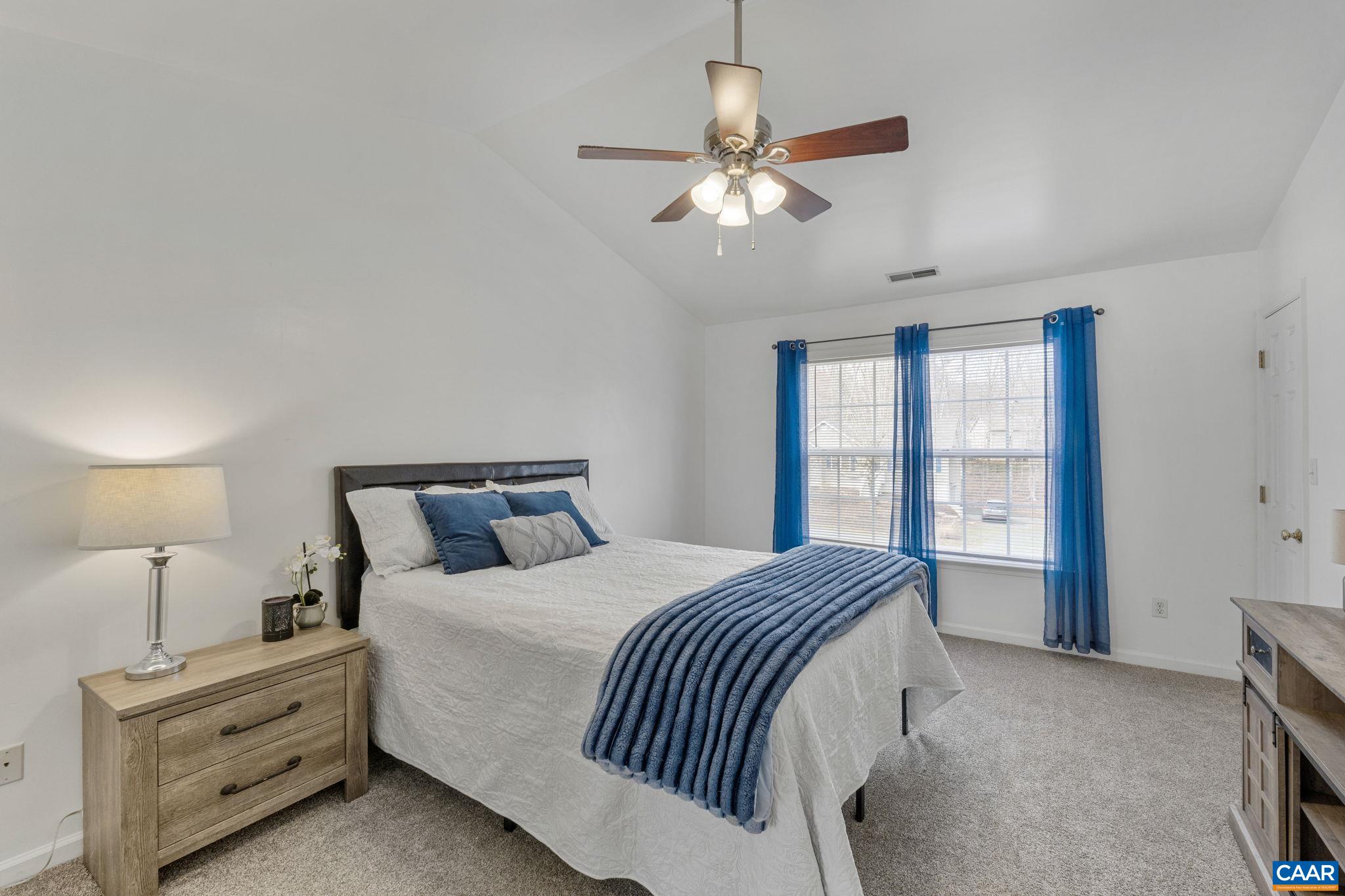89 Riverside Drive Palmyra, VA 22963 - Photo 2 of 38 a bedroom with a bed and window