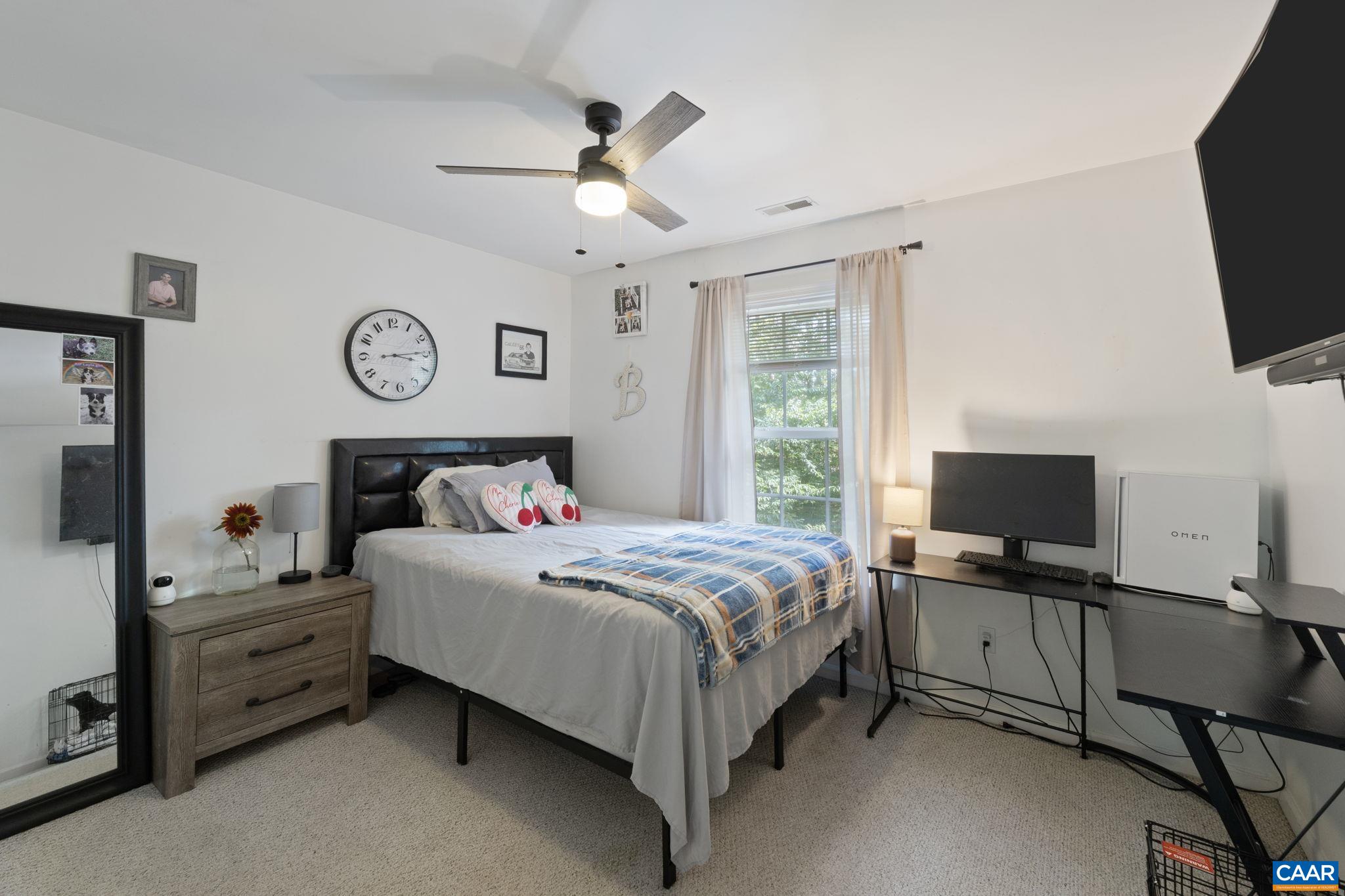 89 Riverside Drive Palmyra, VA 22963 - Photo 22 of 47 a bedroom with a bed and a flat screen tv