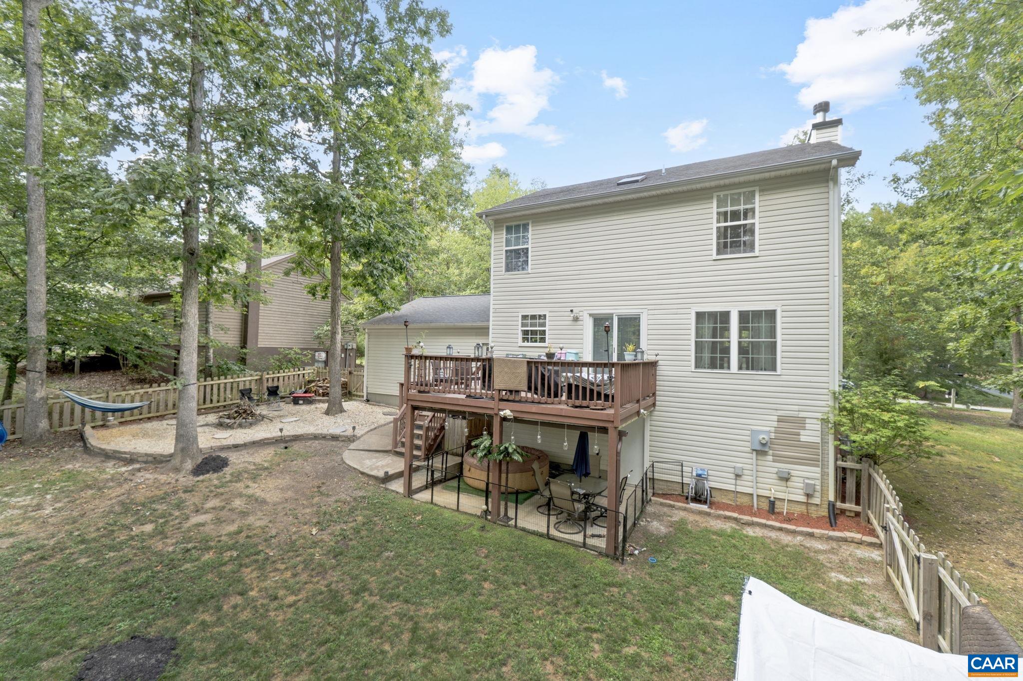 89 Riverside Drive Palmyra, VA 22963 - Photo 25 of 38 a view of a house with backyard sitting area and garden