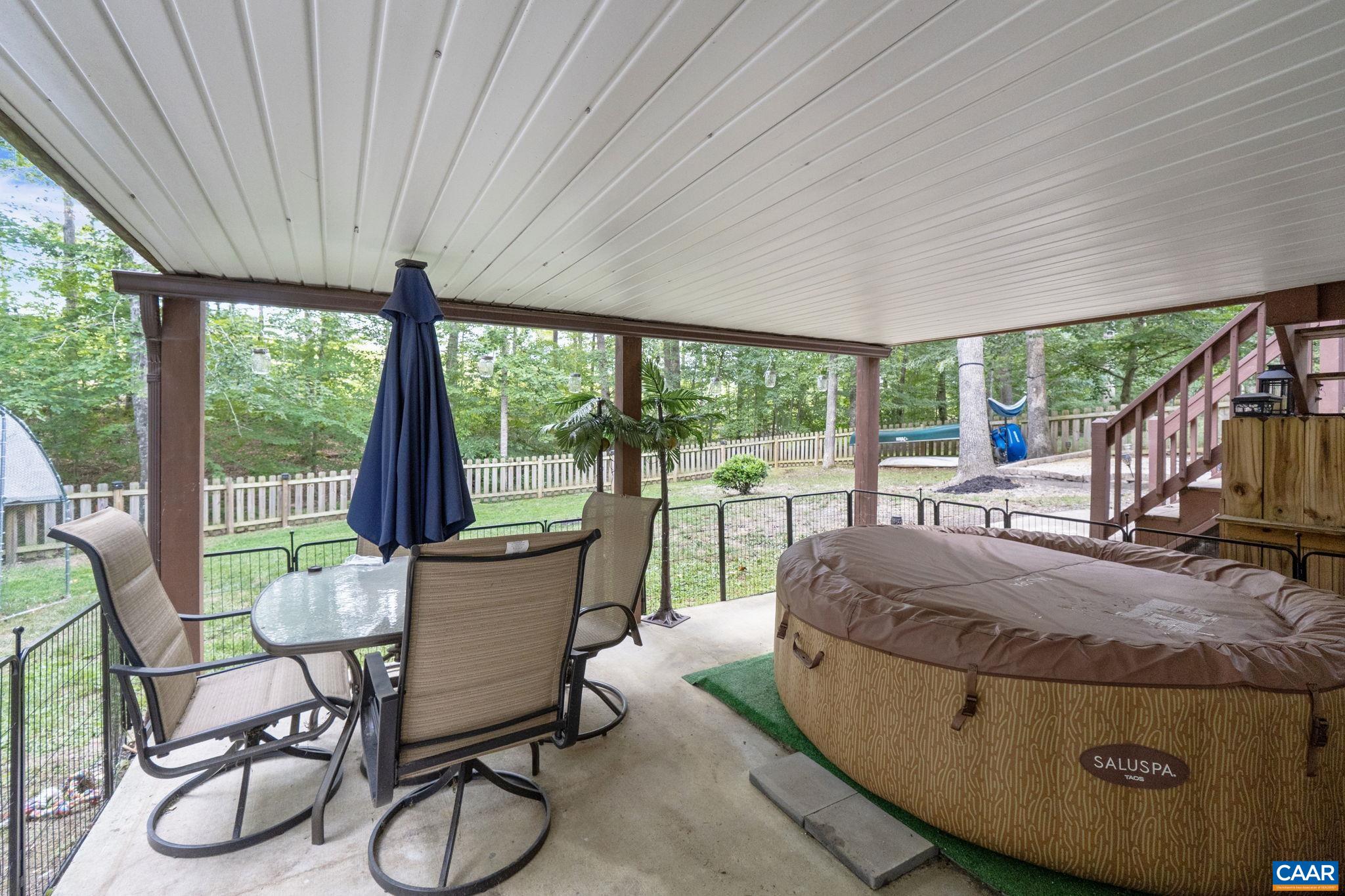 89 Riverside Drive Palmyra, VA 22963 - Photo 32 of 47 a living room with furniture and a floor to ceiling window