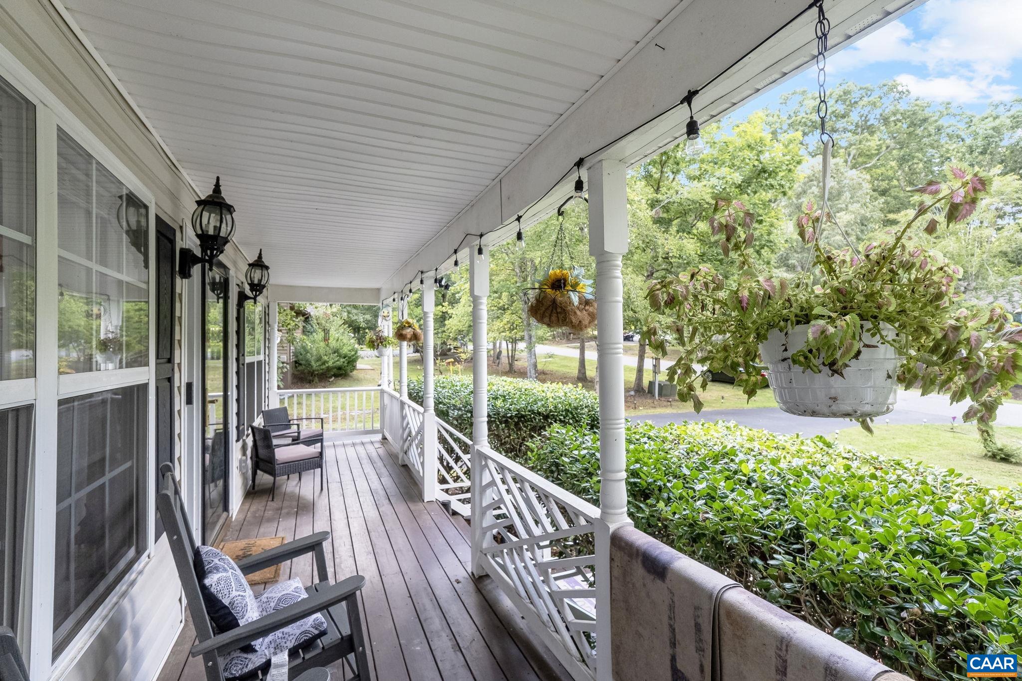 89 Riverside Drive Palmyra, VA 22963 - Photo 5 of 47 a view of a porch with furniture and a yard
