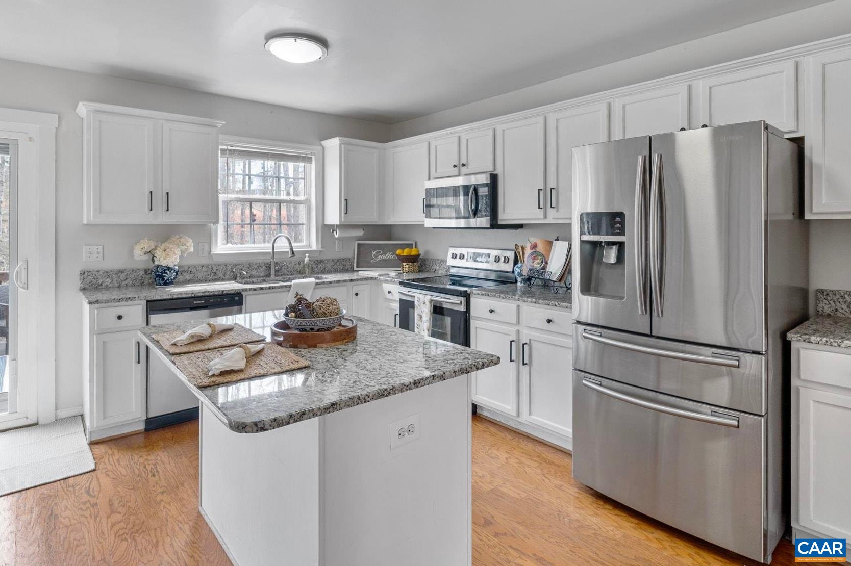 89 Riverside Drive Palmyra, VA 22963 - Photo 8 of 38 a kitchen with stainless steel appliances granite countertop a sink stove and refrigerator