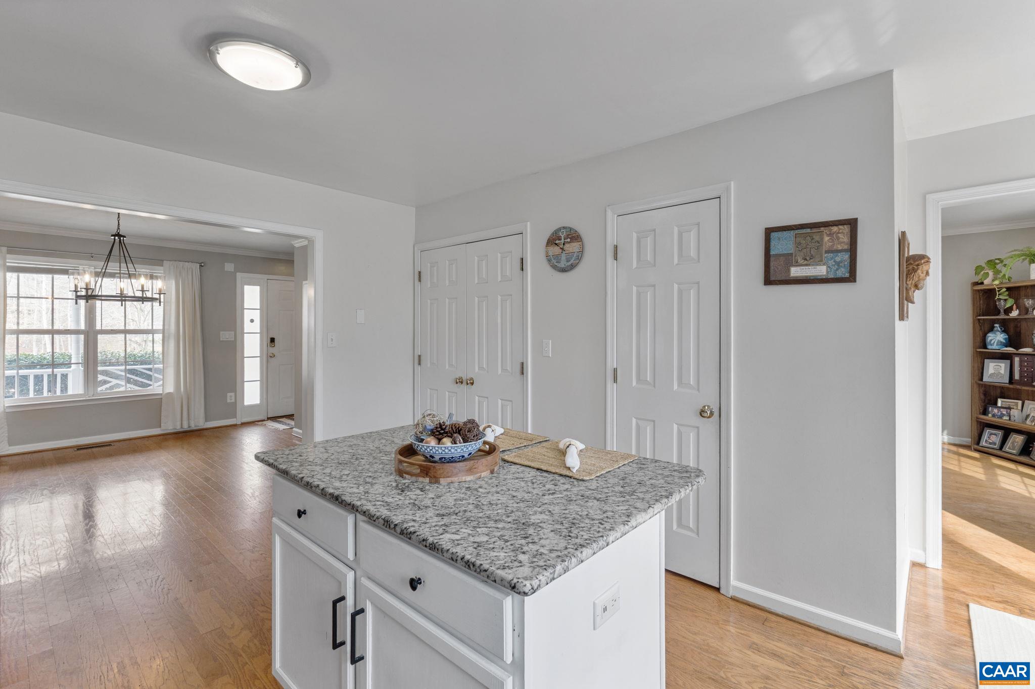 89 Riverside Drive Palmyra, VA 22963 - Photo 9 of 38 a kitchen with granite countertop a sink cabinets and wooden floor