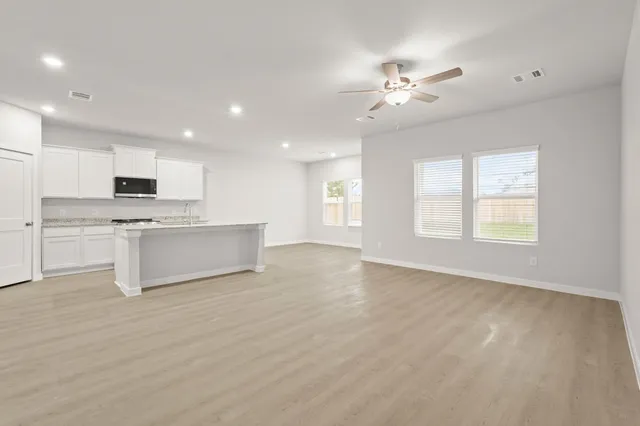 a view of a kitchen with a sink cabinets and outdoor space