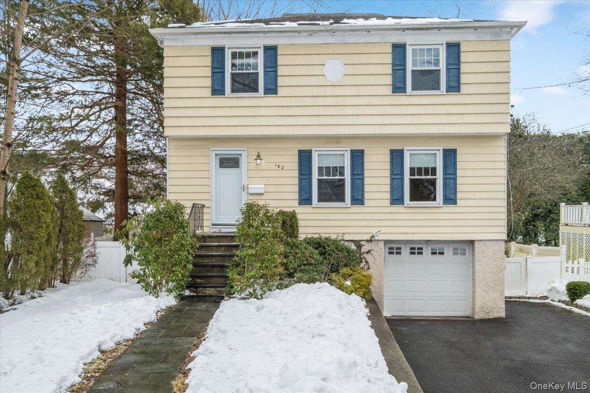 182 Madison Road Scarsdale, NY 10583 - Photo 1 of 30 a front view of a house with trees