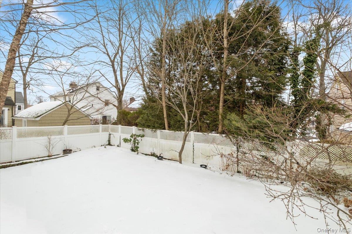 182 Madison Road Scarsdale, NY 10583 - Photo 11 of 30 a view of backyard with a large tree