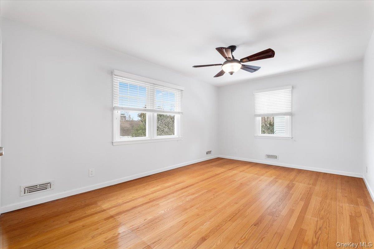 182 Madison Road Scarsdale, NY 10583 - Photo 16 of 30 an empty room with a window and a ceiling fan