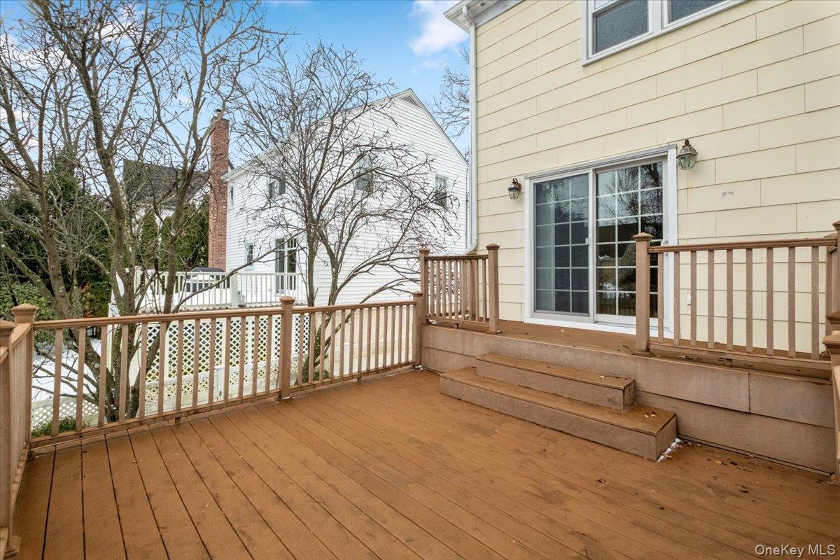 182 Madison Road Scarsdale, NY 10583 - Photo 26 of 30 a view of backyard with wooden deck and large tree