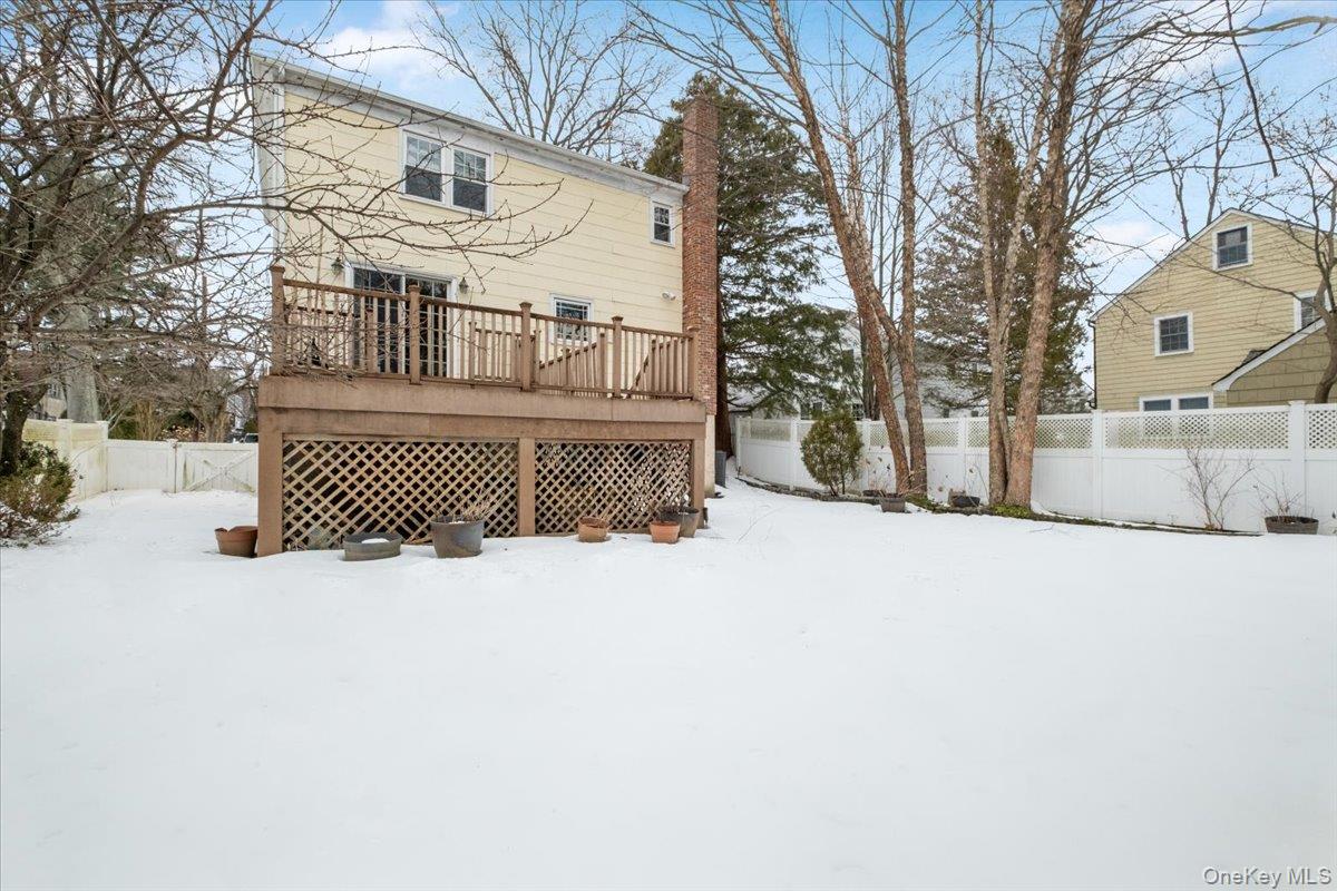 182 Madison Road Scarsdale, NY 10583 - Photo 3 of 30 a front view of a house with a snow in the yard