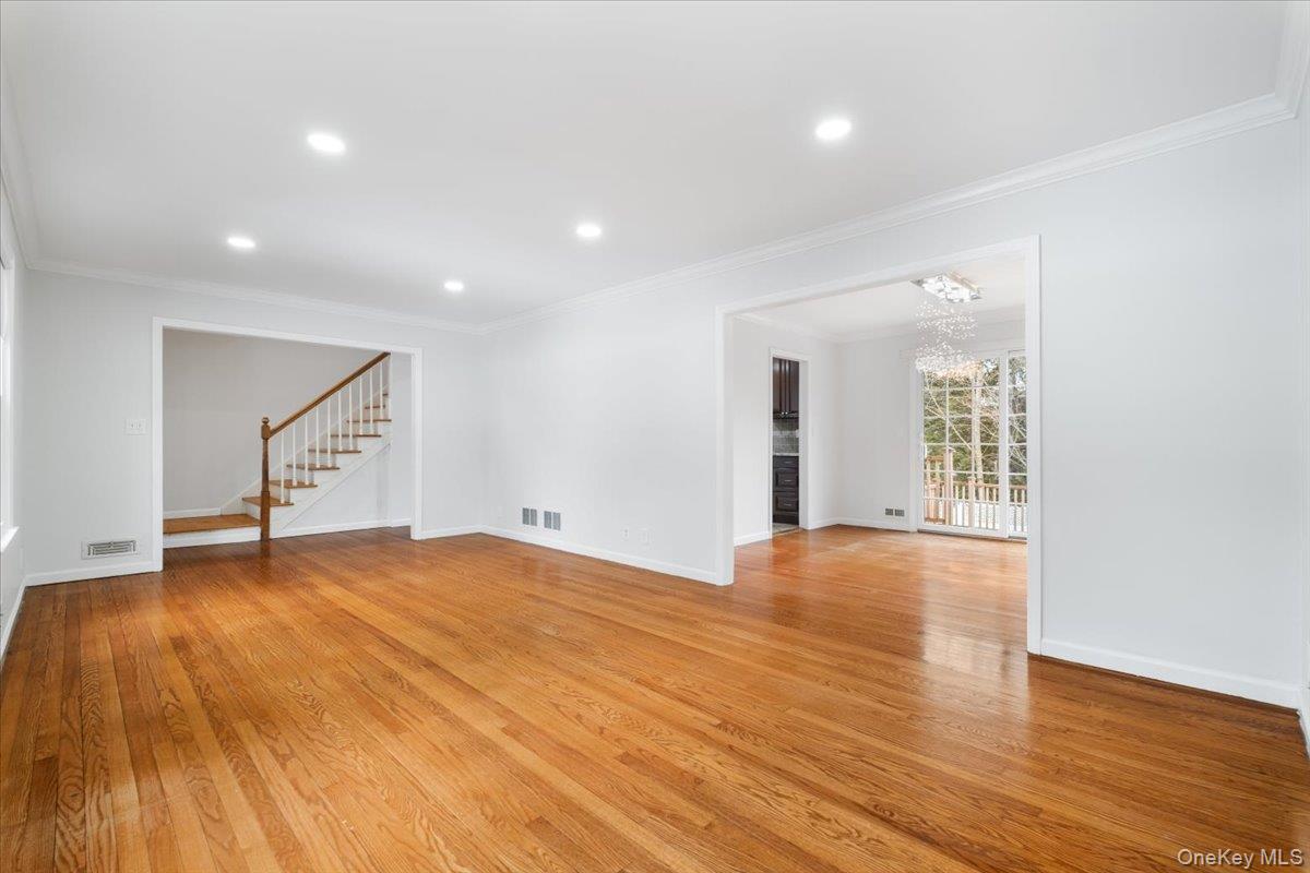 182 Madison Road Scarsdale, NY 10583 - Photo 7 of 30 a view of an empty room with wooden floor and a window