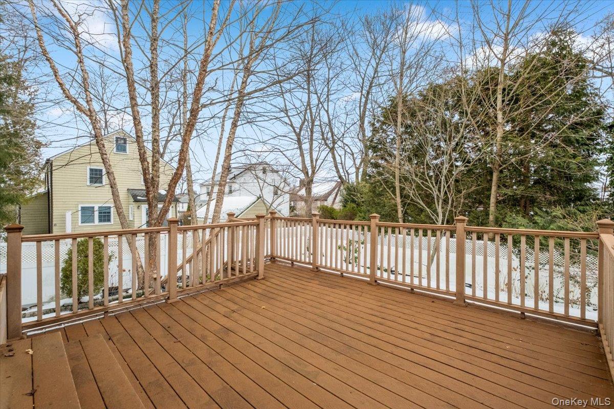 182 Madison Road Scarsdale, NY 10583 - Photo 10 of 30 a view of deck with wooden floor and fence