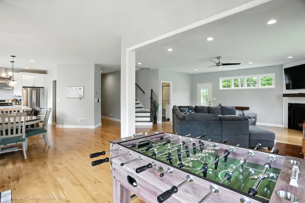 a kitchen with stainless steel appliances kitchen island granite countertop a stove and a sink