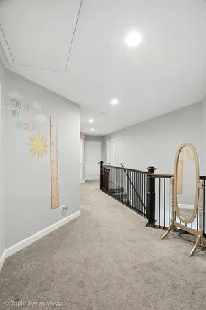 a view of hallway with wooden floor