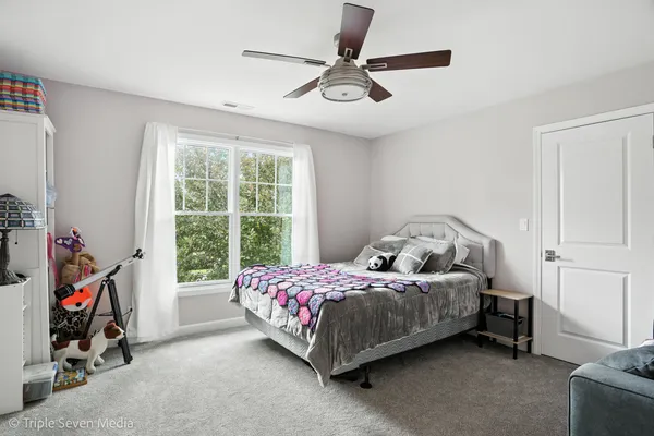 a bedroom with a bed and cabinets