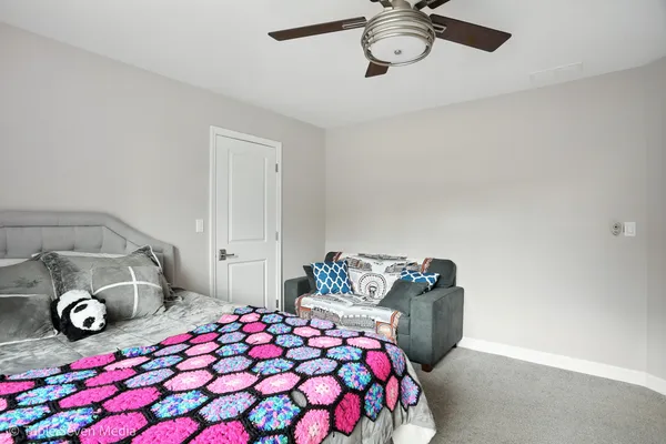 a bed room with a bed and a window