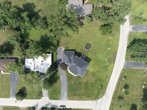 an aerial view of residential house with outdoor space