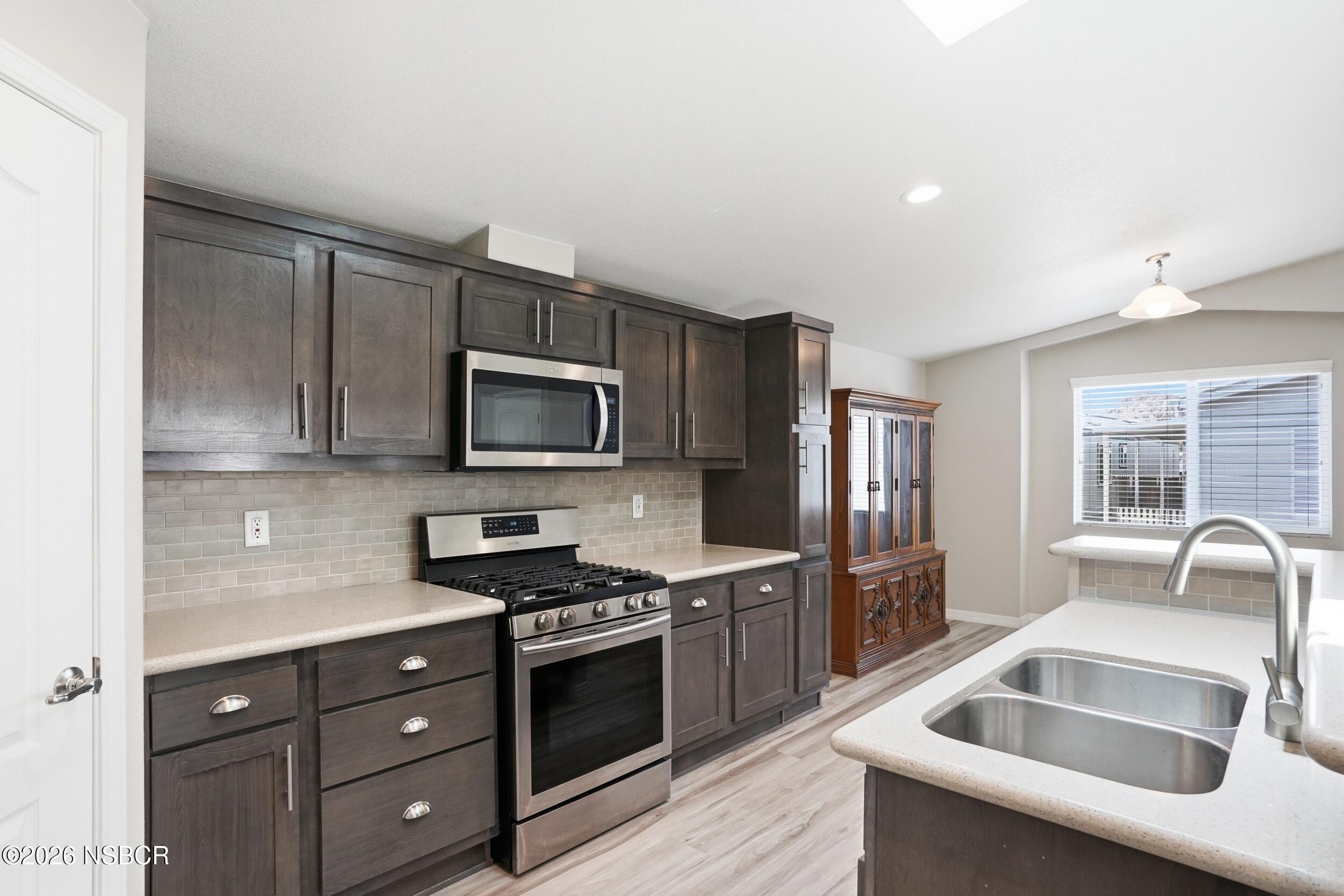500 Atascadero Road, Unit M3 Morro Bay, CA 93442 - Photo 11 of 29 a kitchen with granite countertop a sink and steel appliances