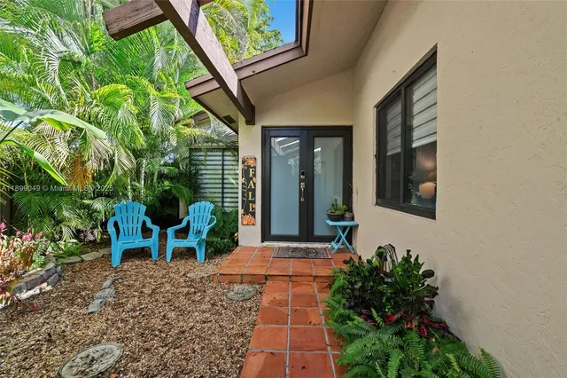 a view of two chairs in the balcony