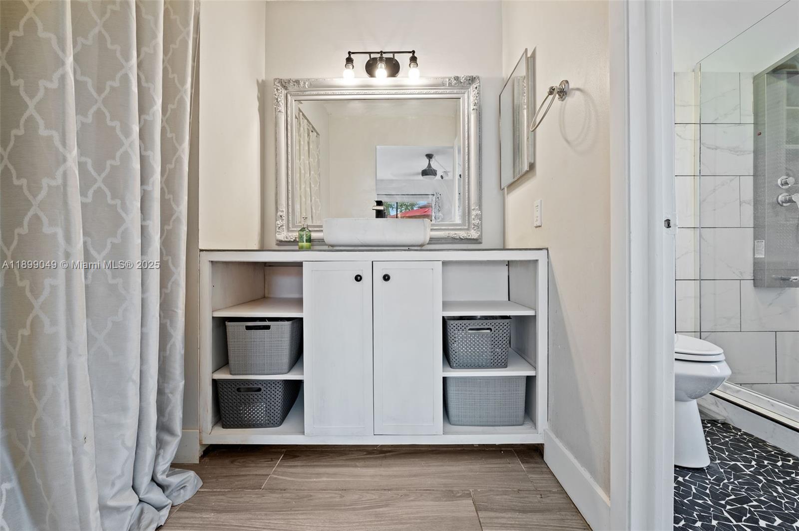 10923 Southwest 134th Court Miami, FL 33186 - Photo 12 of 28 a bathroom with a sink and a mirror