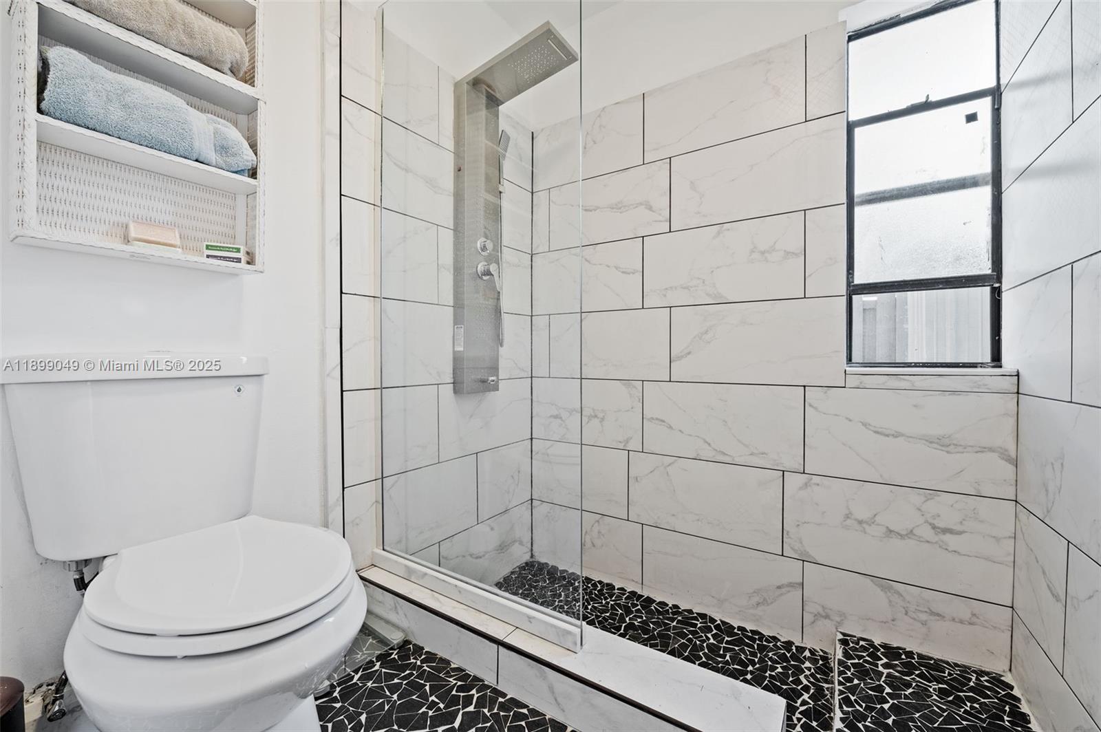 10923 Southwest 134th Court Miami, FL 33186 - Photo 13 of 28 a bathroom with a toilet and a shower