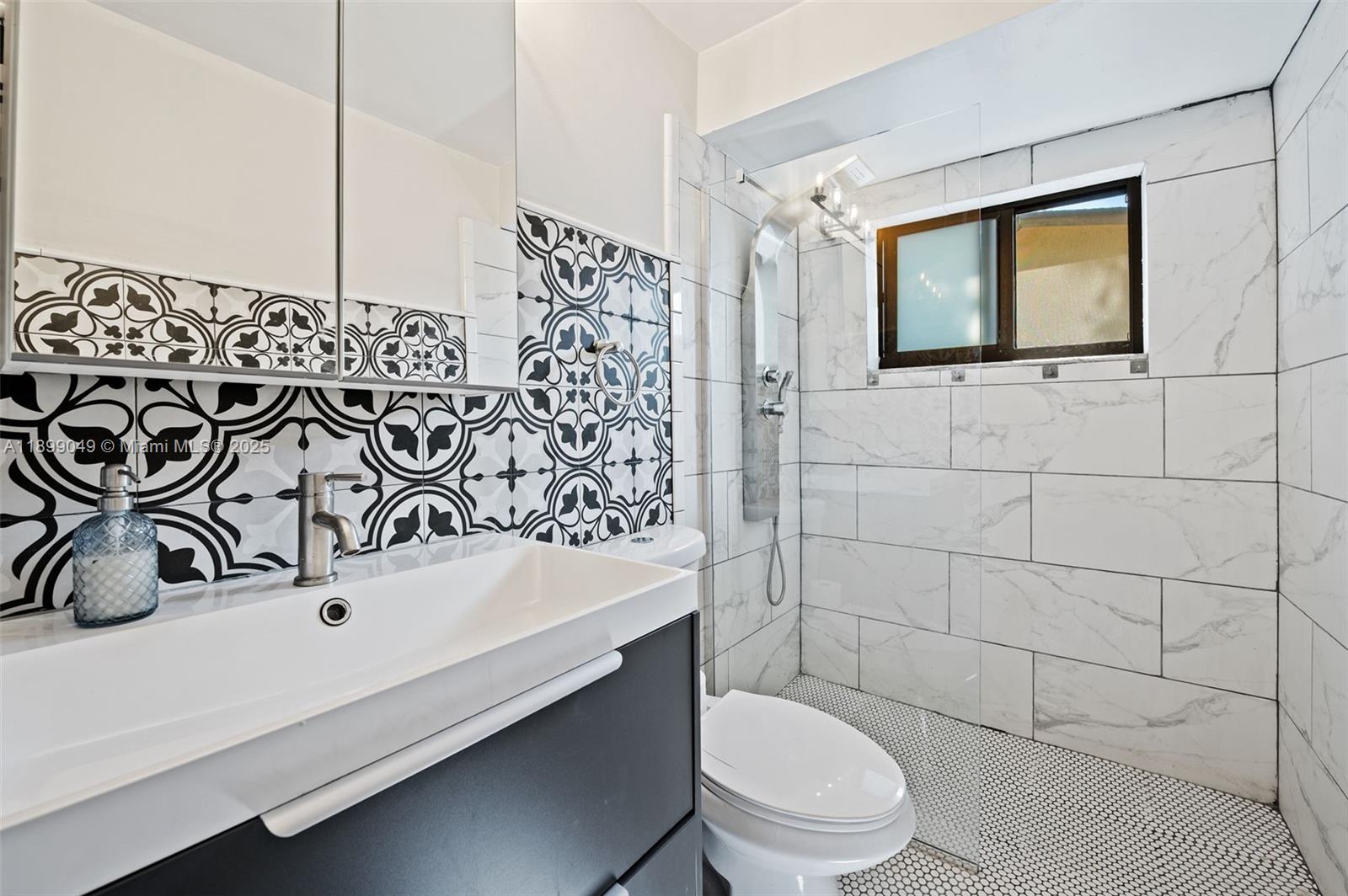 10923 Southwest 134th Court Miami, FL 33186 - Photo 18 of 28 a bathroom with a sink toilet and shower