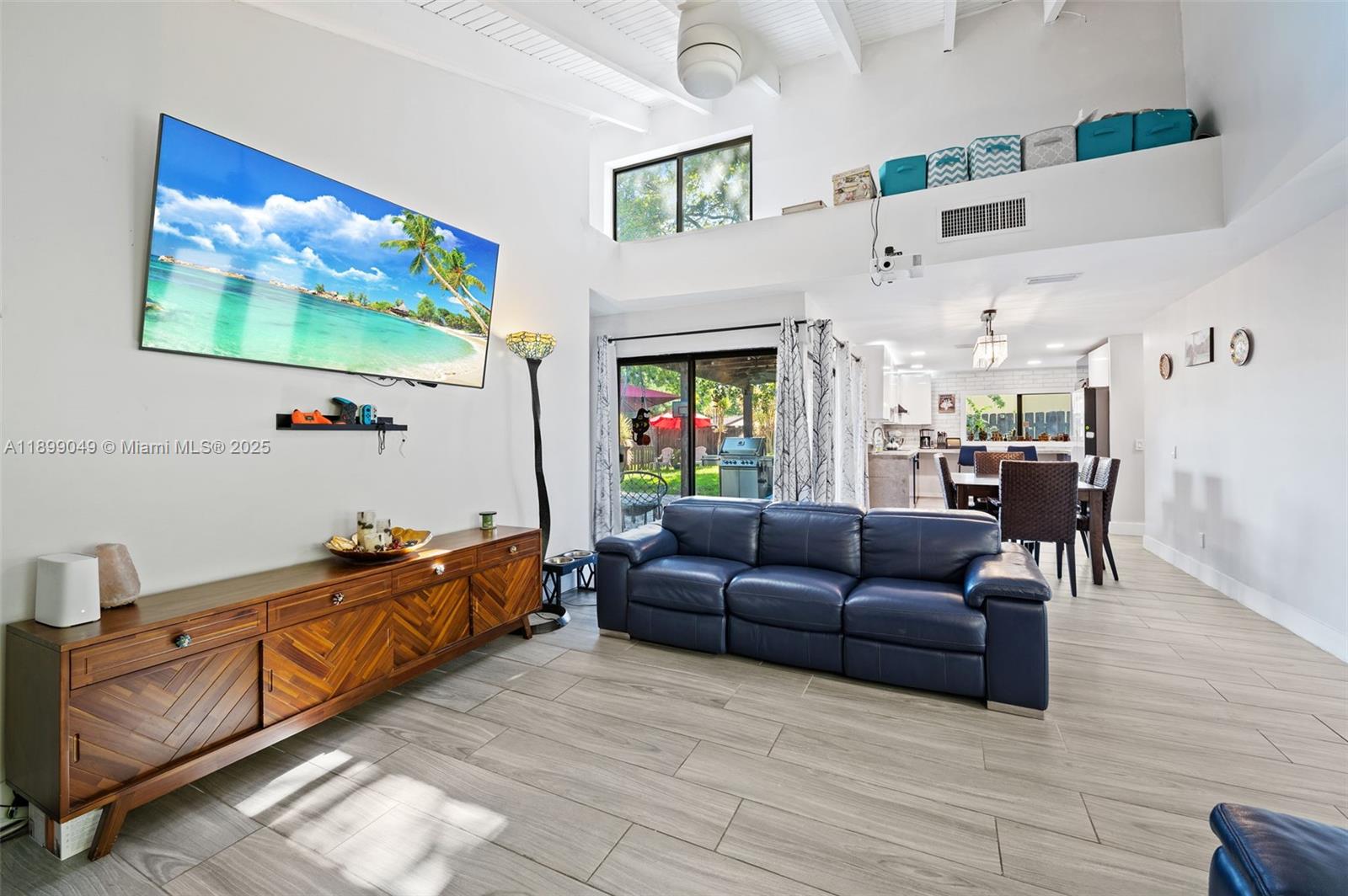 10923 Southwest 134th Court Miami, FL 33186 - Photo 5 of 28 a living room with furniture and a flat screen tv