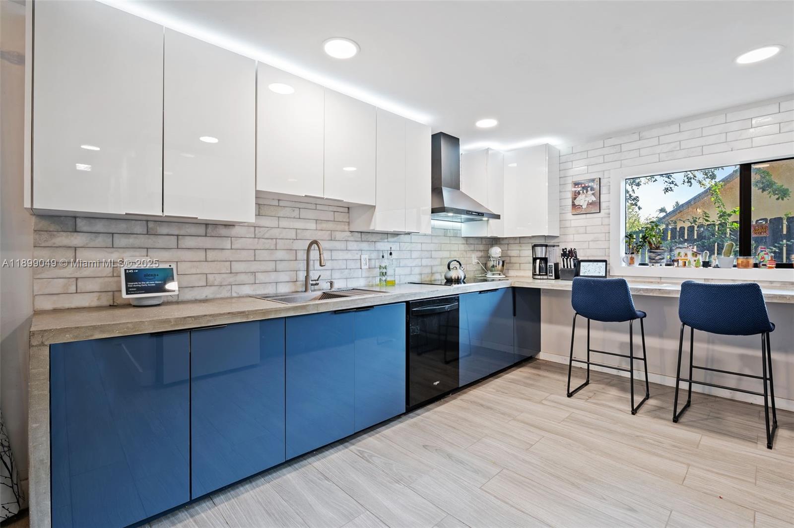10923 Southwest 134th Court Miami, FL 33186 - Photo 8 of 28 a kitchen with stainless steel appliances kitchen island granite countertop a sink and cabinets