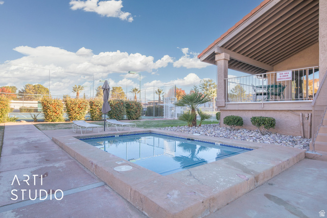 860 South Village Road, Unit A6 St. George, UT 84770 - Photo 18 of 41 Community pool featuring a patio