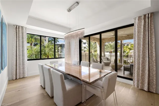 a dining room with a large window and table