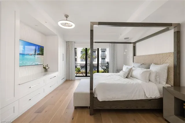 a bedroom with a large bed and a window