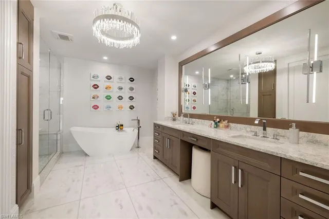 a spacious bathroom with a bathtub sink and mirror