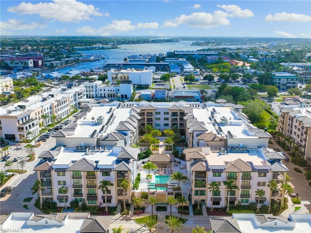 1130 3rd Avenue South, Unit 210 Naples, FL 34102 - Photo 2 of 48 a view of city with tall buildings