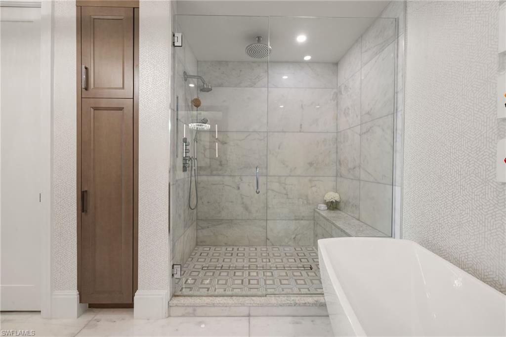 1130 3rd Avenue South, Unit 210 Naples, FL 34102 - Photo 22 of 48 a bathroom with a shower