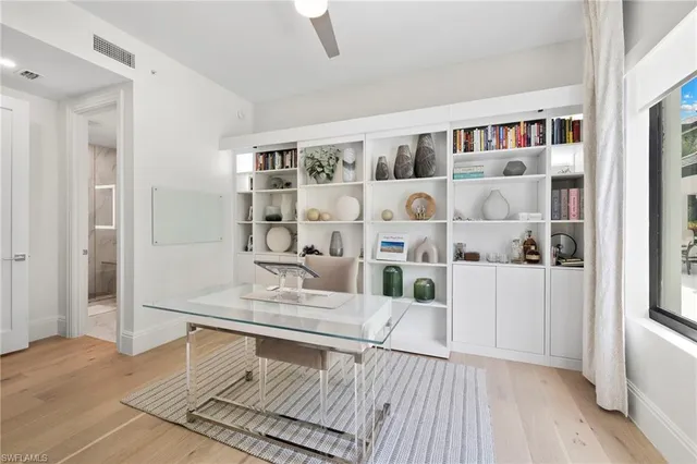 a living room with furniture and white walls