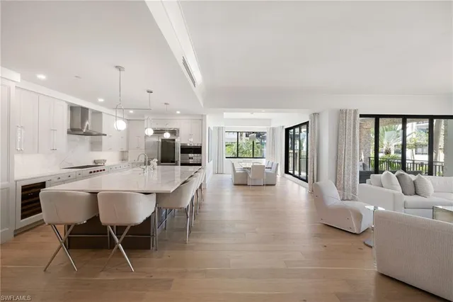 a dining room with furniture and a view of kitchen