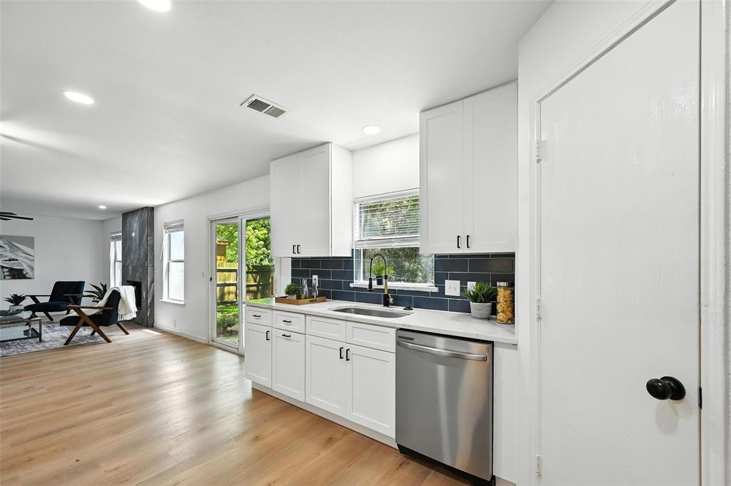 6218 Everglade Road Dallas, TX 75227 - Photo 11 of 39 Kitchen featuring stainless steel dishwasher, light countertops, backsplash, white cabinets, and recessed lighting