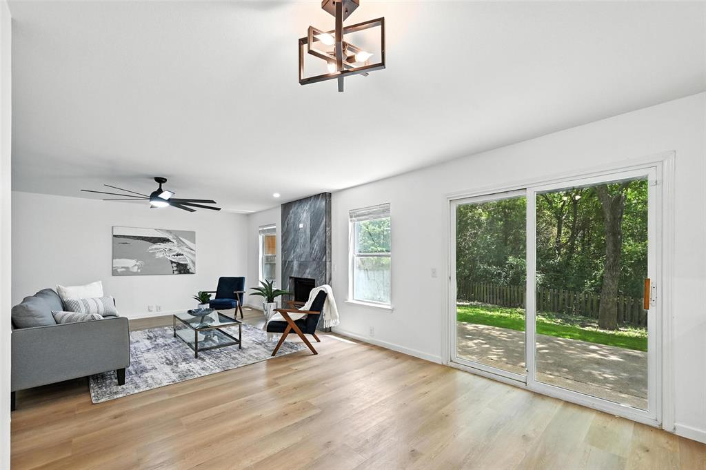 6218 Everglade Road Dallas, TX 75227 - Photo 13 of 39 Living room featuring wood finished floors and baseboards