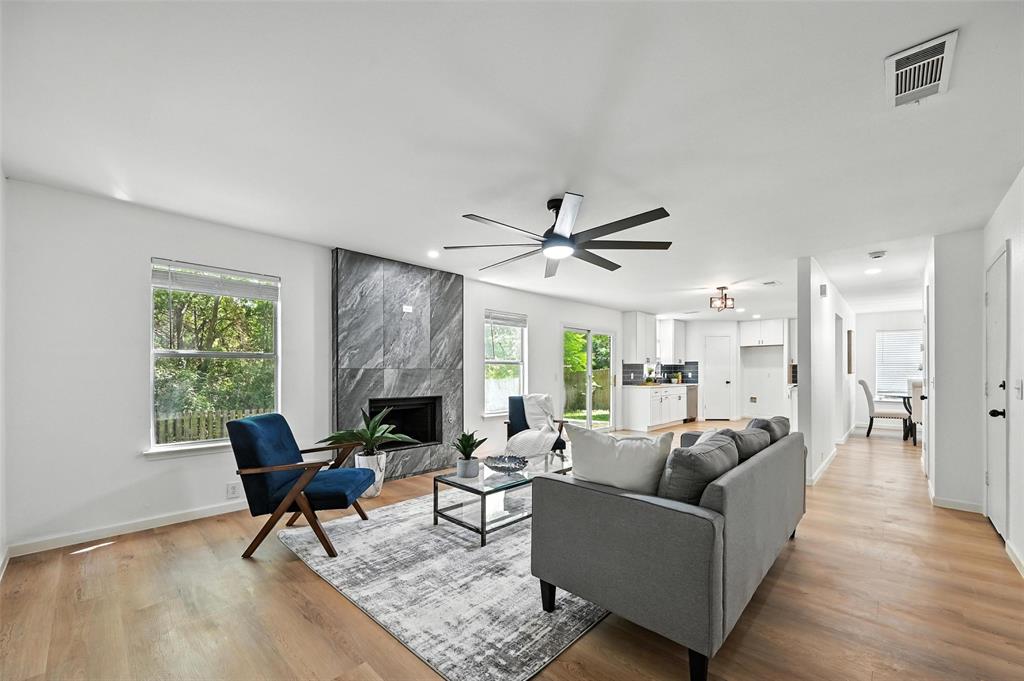 6218 Everglade Road Dallas, TX 75227 - Photo 18 of 39 Living area with a high end fireplace, light wood-style floors, ceiling fan, and recessed lighting
