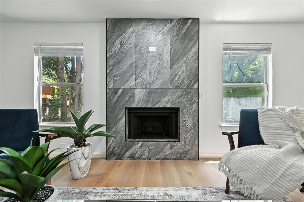 6218 Everglade Road Dallas, TX 75227 - Photo 20 of 39 Living room with wood finished floors and a premium fireplace