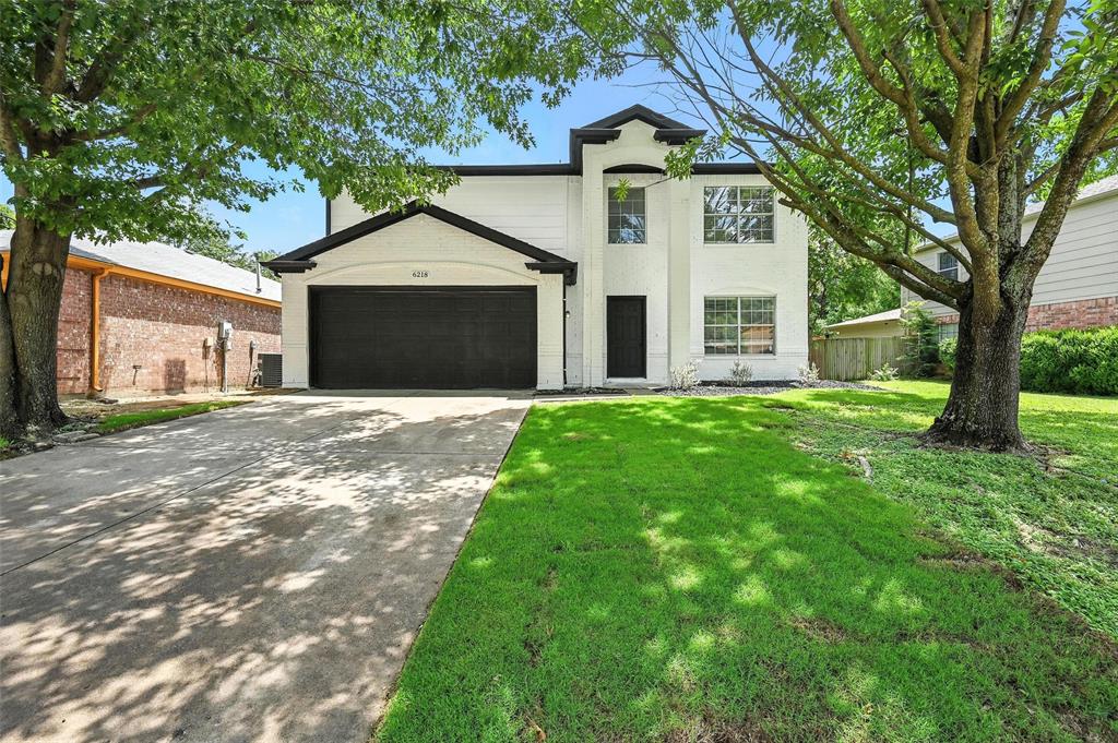 6218 Everglade Road Dallas, TX 75227 - Photo 2 of 39 View of front of house featuring an attached garage and driveway