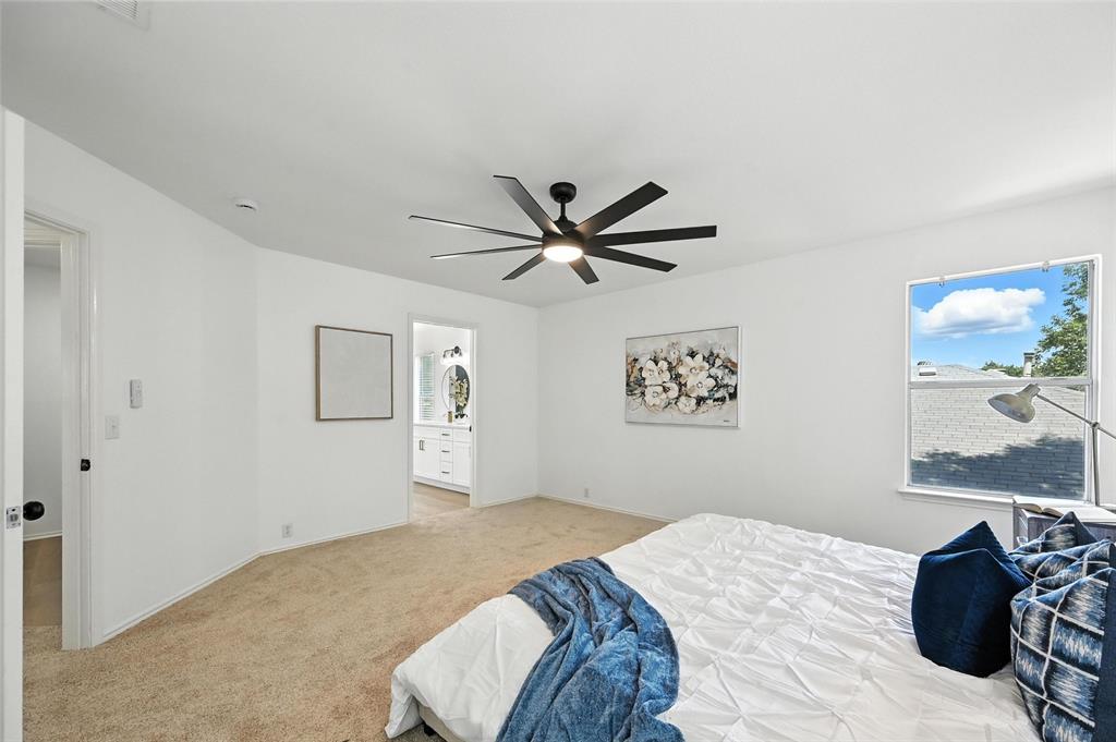 6218 Everglade Road Dallas, TX 75227 - Photo 22 of 39 Bedroom with light carpet, ensuite bath, and ceiling fan